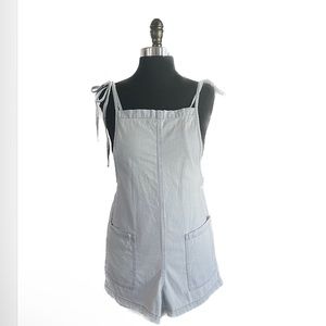 Arizona tie on overalls in light wash blue denim with large front pockets.